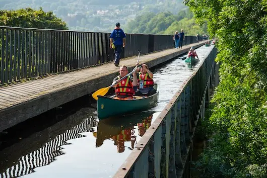 Open canoe paddling along the Pontcysyllte Aqueduct